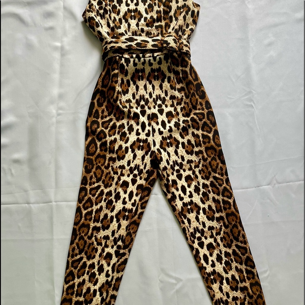 Leopard print body suit with belt.